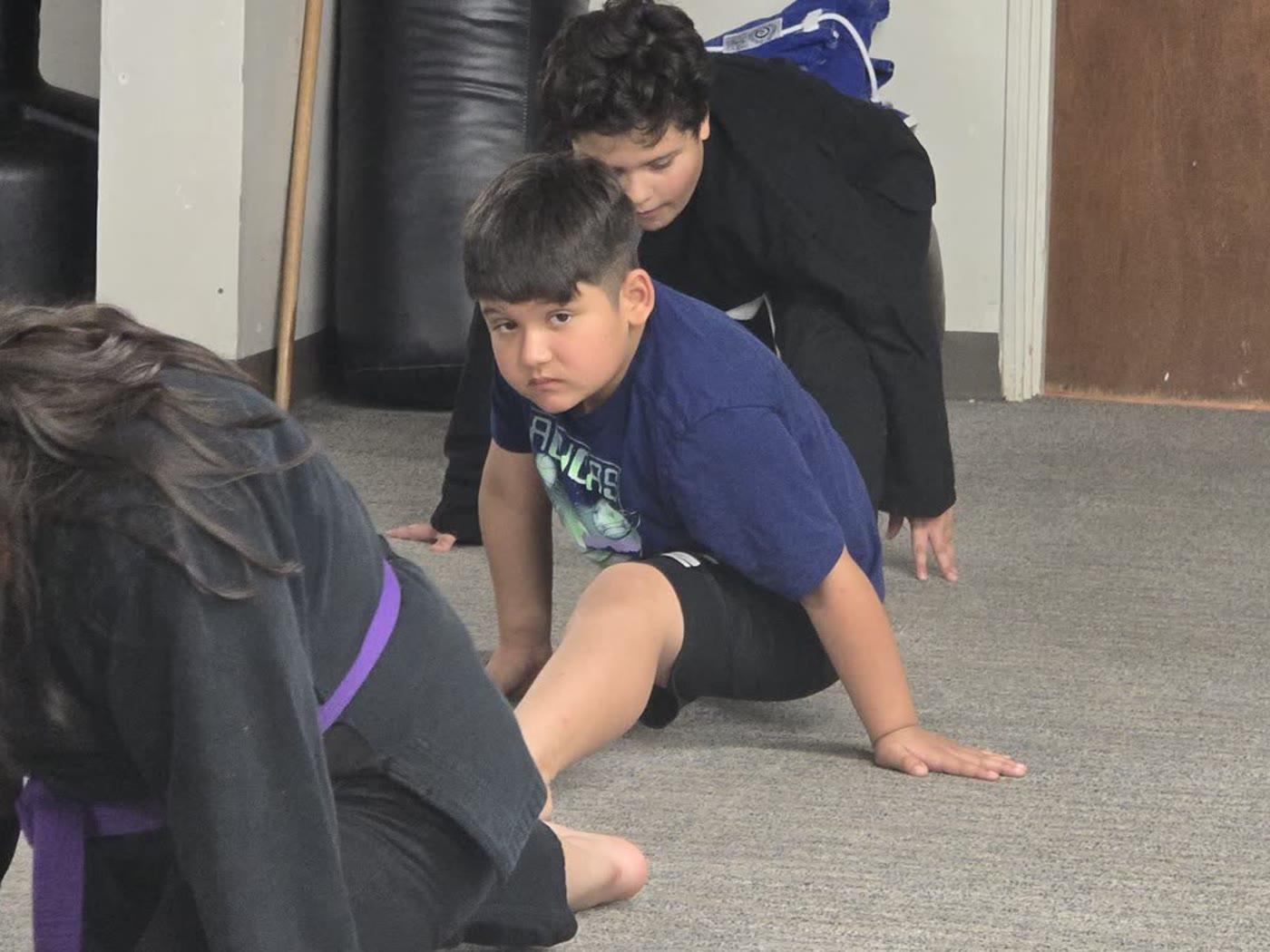 Youth students doing conditioning drills during class