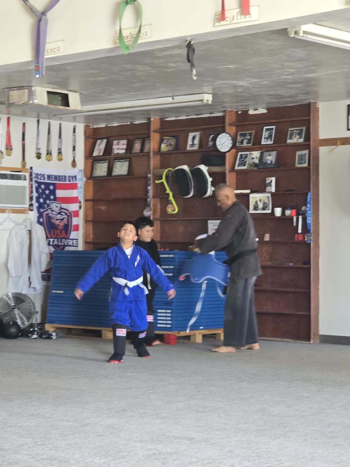 Pad drills with an instructor at the dojo